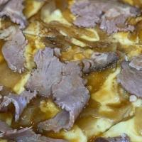 French Dip Pizzette (Personal) · Bechamel sauce, roast beef, Swiss cheese, caramelized onions.