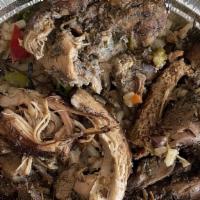 Jerk Chicken With Rice & Peas · Boneless chicken, marinated in Jamaican jerk spices served with parboiled rice with well-coo...