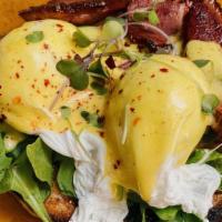Eggs Benny · smoked duck, roasted pepper purée, poached eggs, topped w/ hollandaise on sourdough.