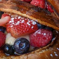 French Toast · Challah bread, strawberry compote, mixed berries, banana marmalade, crispy bacon, mascarpone.