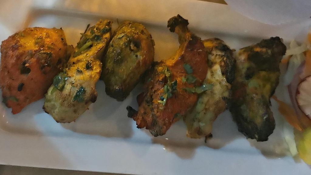 Kabab Sampler · Chicken tikka, chicken malai kabab and chicken haryali.