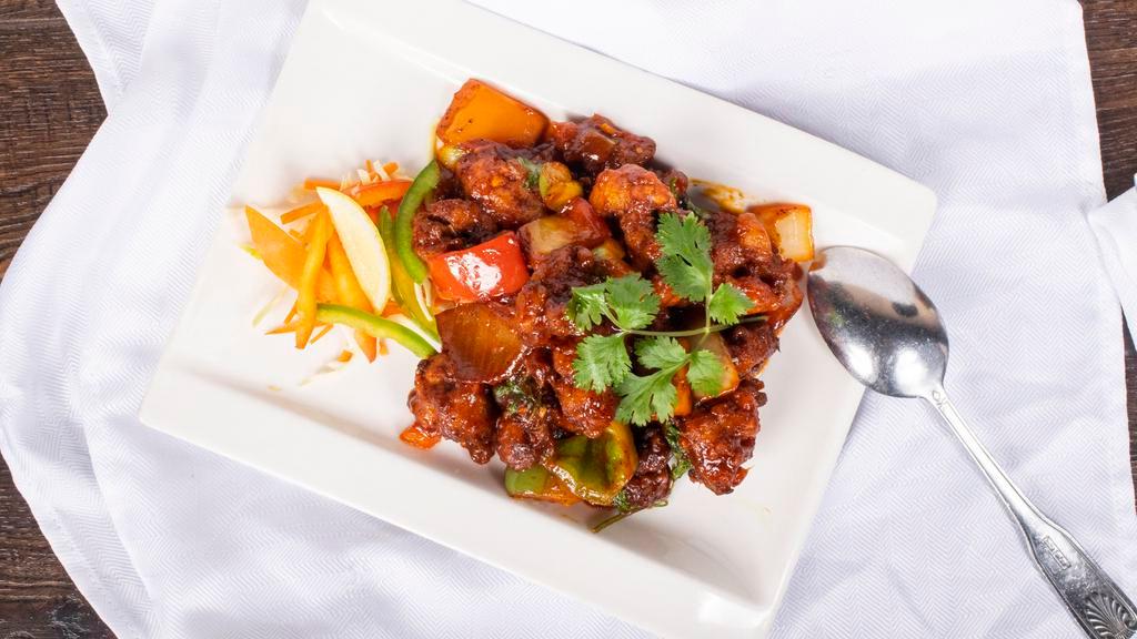 Gobi Manchurian · Spicy. Dry or gravy. Batter-fried cauliflower tossed with garlic, onions and ginger.