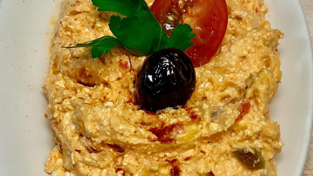 Spicy Feta · Spicy feta dip with sundry tomato, roasted pepper, dill, parsley, labne, garlic virgin olive oil.