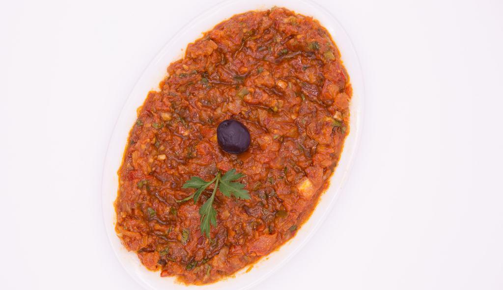 Turkish Ezme · Delicious combination of minced fresh tomatoes, red and green bell pepper, red onion, walnuts, garlic, parsley, dill, pickle, hot pepper and lemon juice.