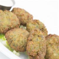 Falafel · A mixture of chickpeas, celery, parsley and green onions tossed in spices and fried, served ...