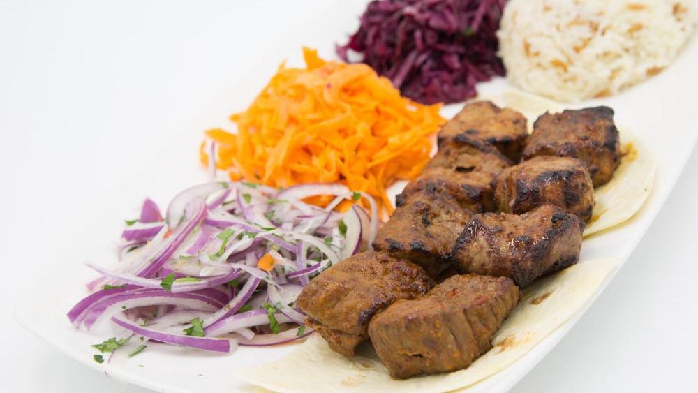 Lamb Shish Kebab · Tender cubes of lamb marinated in our chef's unique seasonings and char-grilled to perfection on skewers.
