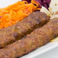Lamb Adana Kebab · A mouth-watering creation of freshly hand chopped lamb flavored with red bell peppers, light...