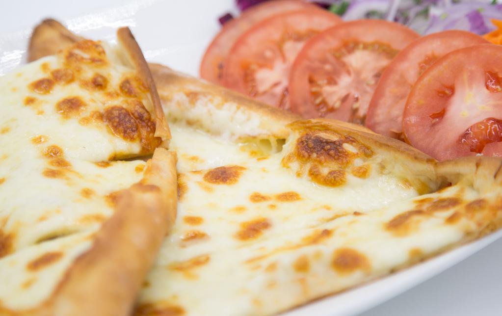 Mozarella Pide Dinner · A crispy crust of dough topped with mozzarella cheese, bell pepper and tomato.