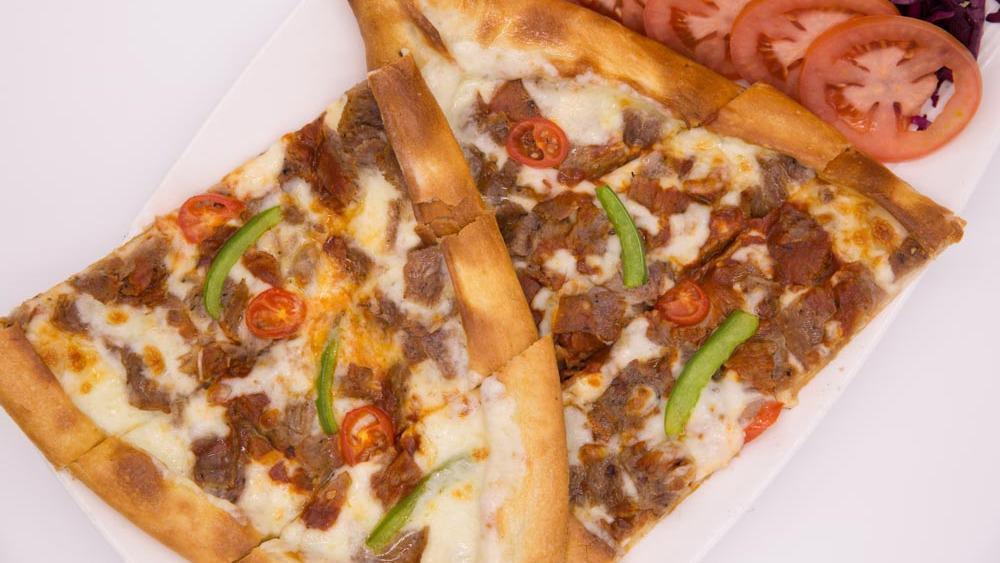 Gyro Pide (Doner Pide) · Crispy crust of dough topped with gyro kebab, mozzarella cheese, tomato sauce, bell pepper and tomato.