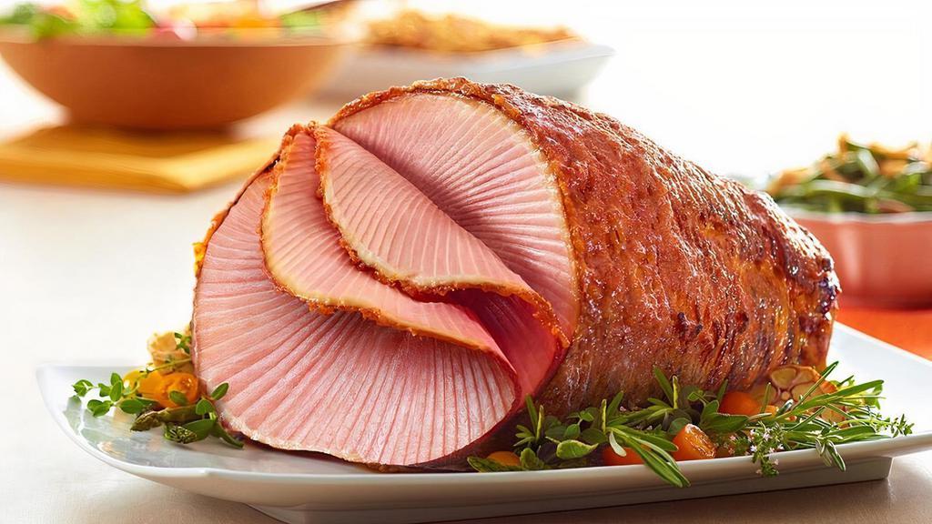 10-10.99Lb Half Ham Bone-In · Our Gold Standard - always moist and tender Bone-In Honey Baked Ham, smoked for up to 24 hours with our special blend of hardwood chips then hand-crafted with our sweet & crunchy glaze. We've been told time and time again that we have the World's Best Ham. Spiral sliced, fully-cooked and ready to serve for convenience.