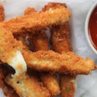 Mozzarella Sticks · Crispy outside with melty Mozzarella inside, this favorite is served with marinara sauce