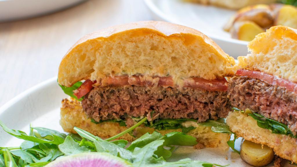  Impossible Burger · Brioche bun, pepperoncini mayo, tomato, red onion, arugula, and roasted potatoes. Vegan