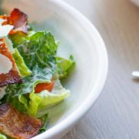 Blt Romaine Caesar Salad · Heart of romaine, tender kale, bacon, heirloom tomatoes, crispy bacon, and shaved parmesan c...