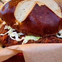Bbq Pulled Pork Sandwich · Island style pulled pork, swimming in chef's secret island BBQ sauce, topped with tiki-slaw ...