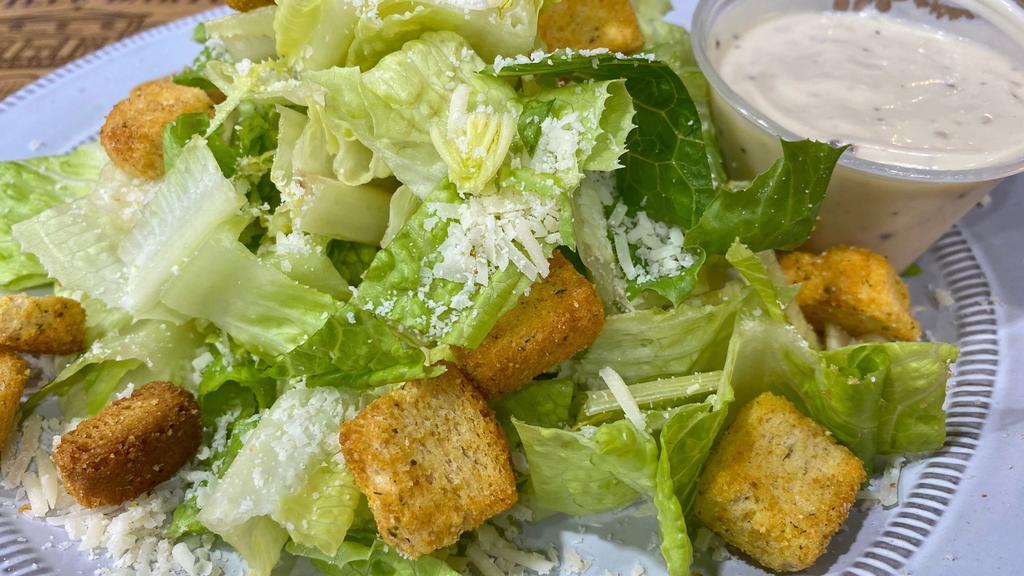 Caesar Salad  · Romaine lettuce, Parmesan cheese, croutons with Caesar dressing.