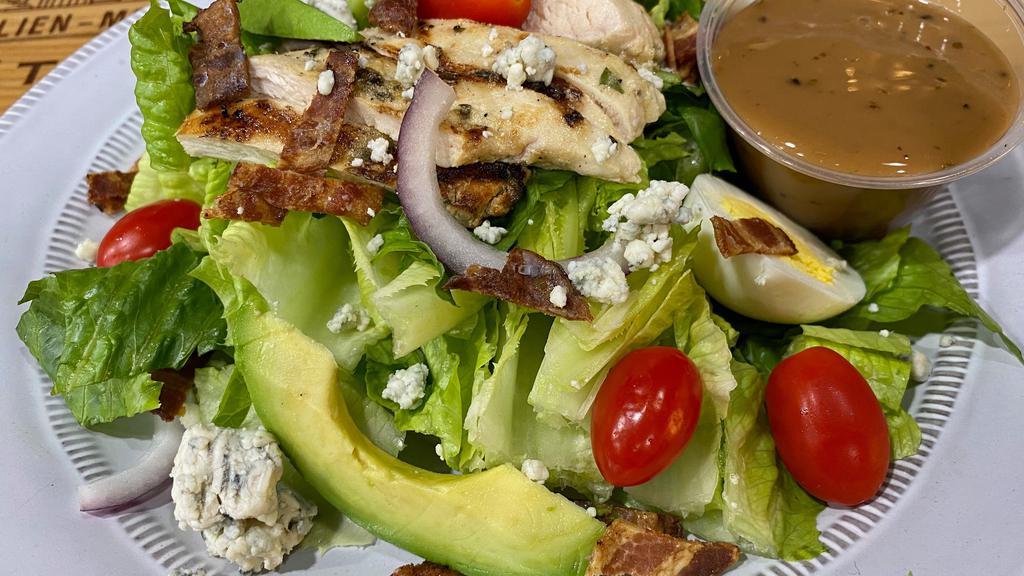 Green Cobb (16 Oz) · Romaine lettuce, boiled eggs, bacon, avocado, blue cheese, grape tomatoes and grilled chicken breast with red wine vinaigrette.