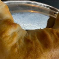 Calzone Meat And Cheese · choice of , pepperoni, sausage or ham