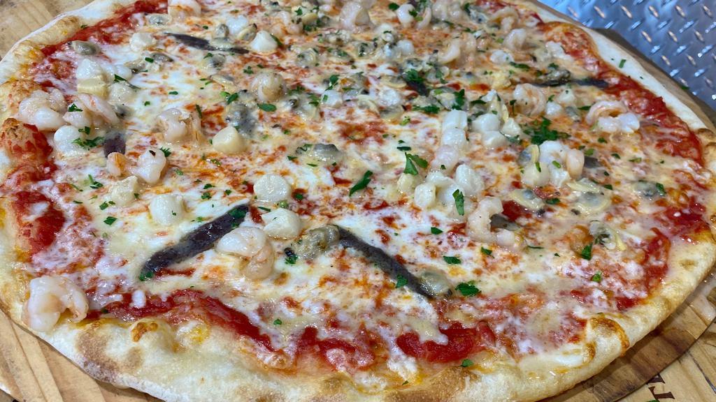 Seafood Pizza · Shrimps in shell, Mussels, ScalLops, fresh basil, mozzarella, fresh garlic, tomato sauce. LARGE