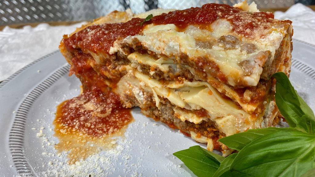 Lasagna Bolognese · Pasta lasagna sheet, mozzarella cheese, parmesan cheese, ricotta cheese, ground beef, garlic and marinara sauce
