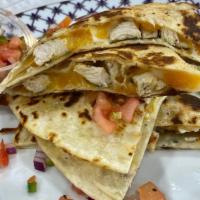 Quesadillas Chicken&Cheese  W/Store Made Salsa · Wrap with cheddar cheese, mozzarella cheese rotisserie chicken and a side of fresh Salsa