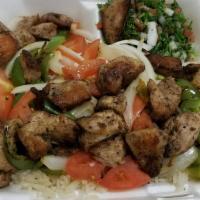 Chicken Kabob · Marinated and grilled, served on a bed of rice with grilled vegetables and tabouli.