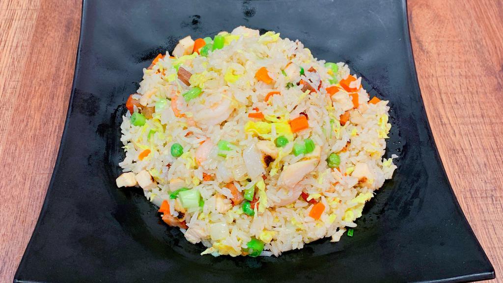 Yang Chow Fried Rice · With chicken, shrimp, and pork.