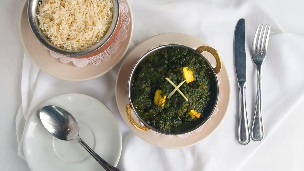 Saag Paneer · Glazed spinach blend with Himalayan cheese. Served with basmati rice.