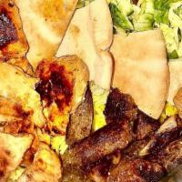 Mix Grill Platter · Chicken and beef souvlaki, rice, salad, tahini, tzatziki sauce.