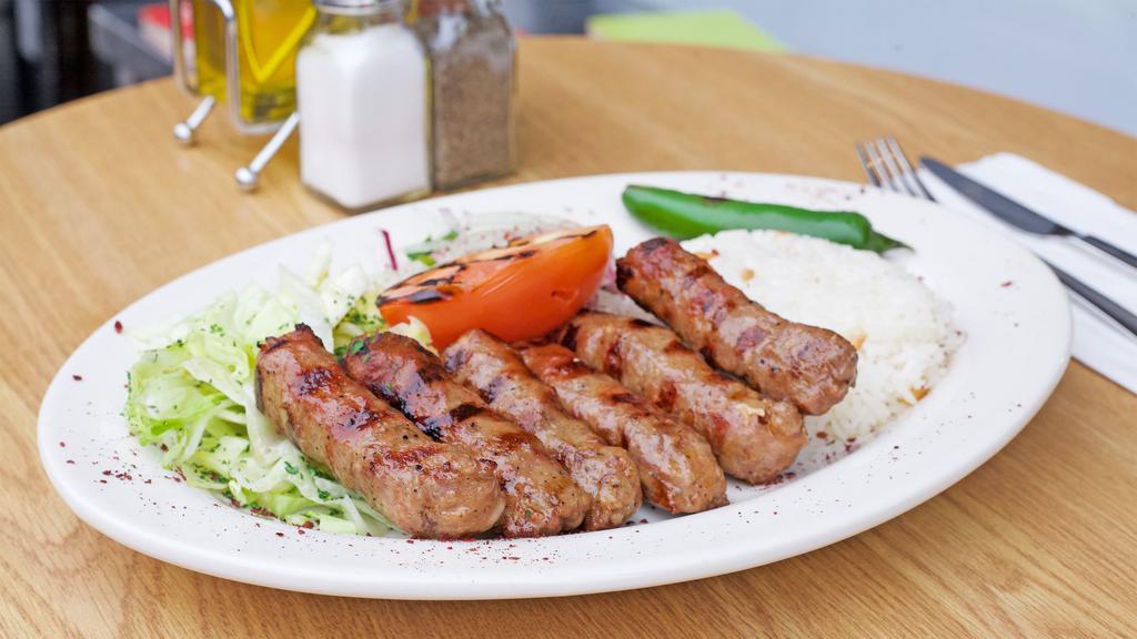 Inegol Kofta Kebab · Minced lamb meat with spices. Comes with salad and rice.