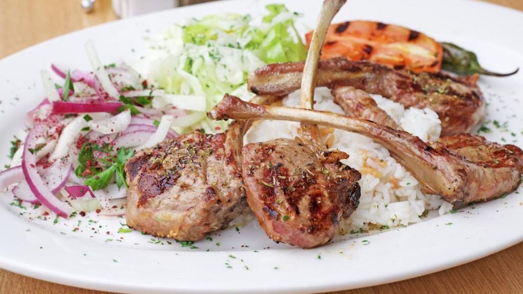 Lamb Chops · Pirzola. Lamb chops grilled to your taste. Small 2 pieces of lamb chops, large is 4 pieces.
comes with salad and rice