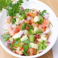 Shepherd Salad (Small) · Fresh tomatoes, cucumbers, onions, and parsley seasoned with our special blend of oil and vi...