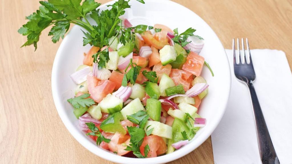 Shepherd Salad (Large) · Fresh tomatoes, cucumbers, onions, and parsley seasoned with our special blend of oil and vinegar.
