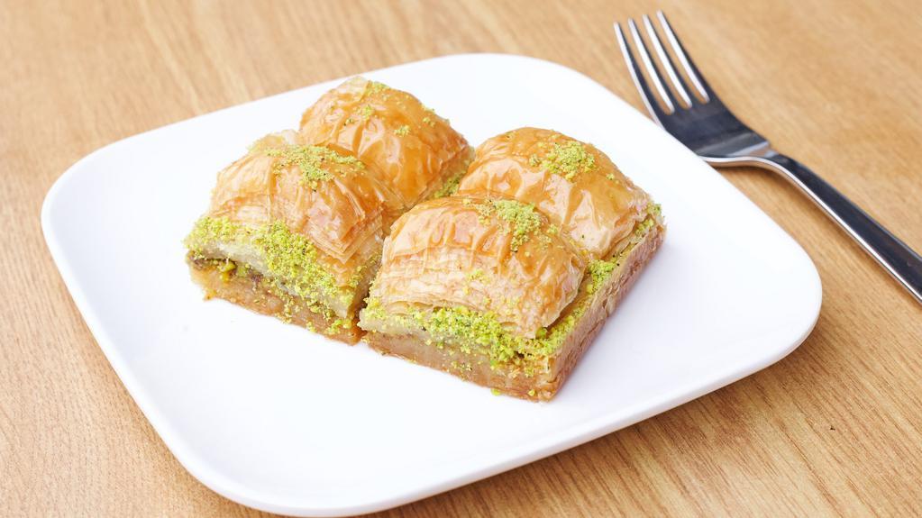 Baklava · 4 pieces. Sweet layered pastry with chopped nuts sweetened with syrup.
