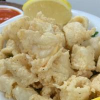 Fried Calamari · Tender calamari lightly fried, served with marinara sauce.