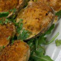 Baked Clams · Baked clams topped with breadcrumbs.