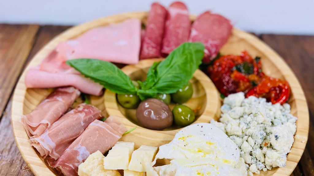 Antipasto Toscano · Assortment of imported cheeses, cured meats, and mixed olives.