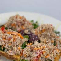 Sicilian Tuna Salad · Imported Sicilian tuna over brick oven flatbread, topped with tomatoes, olives, carrots, and...