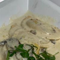 Wild Mushroom Ravioli · ravioli stuffed w/ wild mushrooms in a Portobello cream sauce