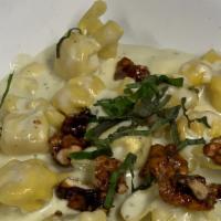 4-Cheese & Pear Fiocchi · Pasta purse filled with 4 cheeses and crisp pieces of fresh pear made in a Gorgonzola sauce,...