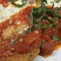 Chicken Cutlet Parmigiana · Chicken cutlet lightly fried with tomato sauce and fresh mozzarella.