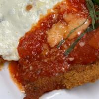 Veal Parmigiana · Veal cutlets topped with fresh mozzarella and tomato sauce.