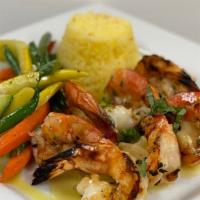 Grilled Shrimp · Shrimp char-grilled with garlic, olive oil, and herbs, in a lemon sauce.