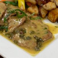 Veal Piccata · Veal medallions in a lemon, white wine, and butter sauce, with capers.