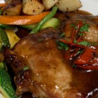 Pork Chop Agro Dolce · 12 oz pan seared pork chop made in a spicy balsamic and cherry pepper reduction.