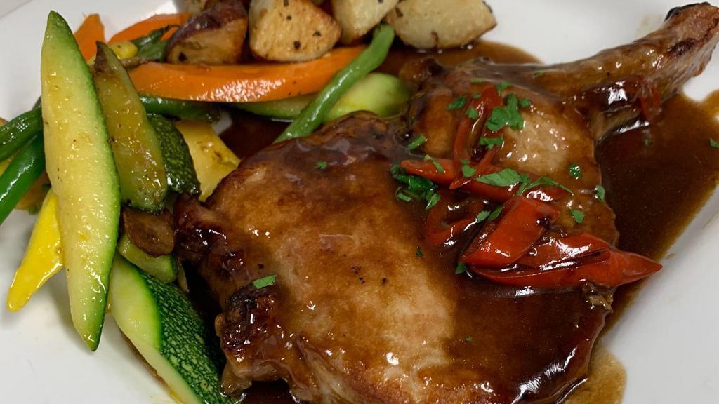 Pork Chop Agro Dolce · 12 oz pan seared pork chop made in a spicy balsamic and cherry pepper reduction.