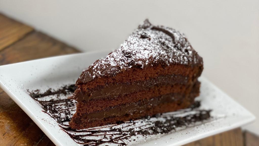 Chocolate Mousse Cake · Chocolate cake layered w/ chocolate mousse, ganache & fondant