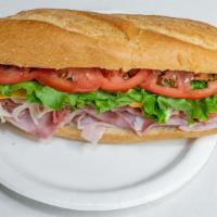 Bald Hill · 1/2 lb of meat. Roast beef, ovengold turkey, ham, American, lettuce, tomato & mayo.