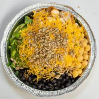 Protein Bowl · Black beans, chick pèas, avocado, grilled chicken, shredded cheddar, sunflower seeds and dre...