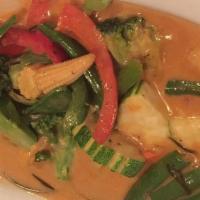 Yellow Curry · Spicy. Yellow curry paste cooked in coconut milk with onions, potatoes, carrots, and string ...