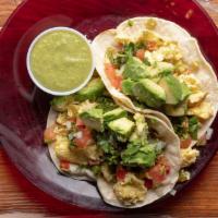 Breakfast Tacos · Two corn tortillas, soft scrambled eggs, poblano peppers, avocado, pico de gallo and green s...